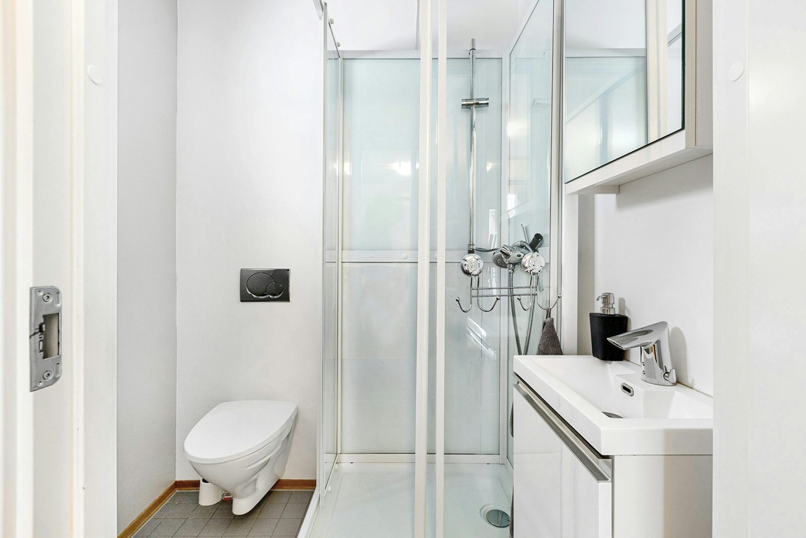 Bright modern bathroom with shower, toilet and basin